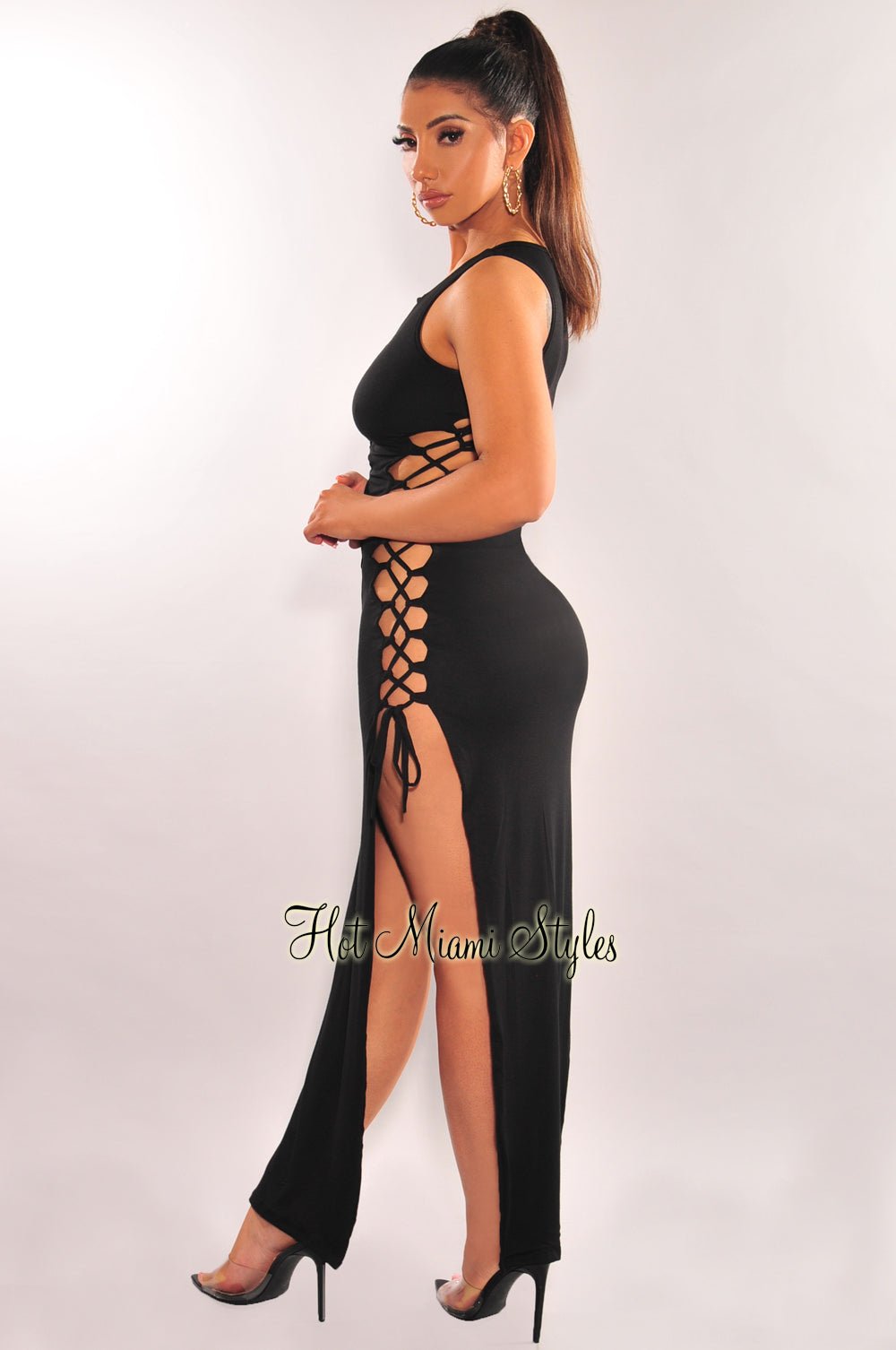 https://hotmiamistyles.com/cdn/shop/products/black-sleeveless-lace-up-sides-double-slit-maxi-dress-hot-miami-styles-179961_1800x1800.jpg?v=1683461517