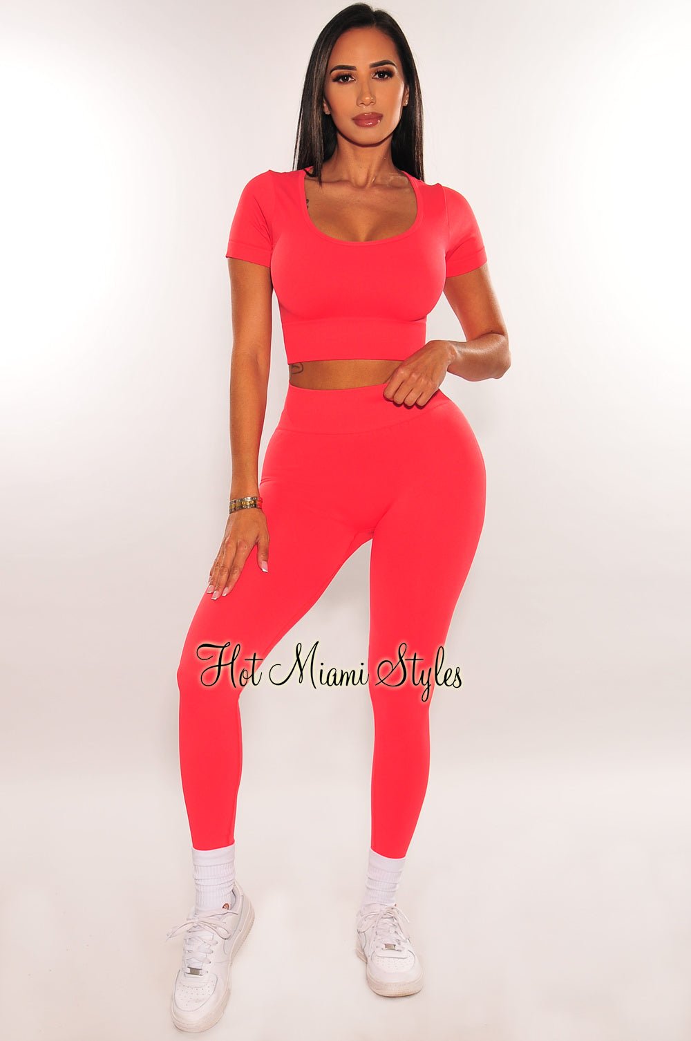 https://hotmiamistyles.com/cdn/shop/products/hms-fit-coral-short-sleeve-scoop-neck-scrunch-butt-legging-two-piece-set-hot-miami-styles-296104_1800x1800.jpg?v=1695636676